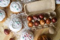 Painted eggs cooked for Easter are in the tray near the pies Royalty Free Stock Photo