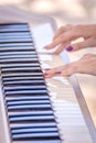 Female fingers on the keys of a musical instrument synthesizer Royalty Free Stock Photo