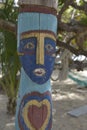 Painted figurine on a post, Beef Island, BVI