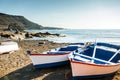 Painted fishing boats on Canary Island shore in bay Royalty Free Stock Photo