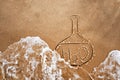 Painted flask and chemical formula of water on sand. The quality of water on the beach and the ocean.