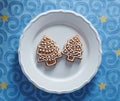 Painted gingerbread cookies in the shape of a Christmas tree on a plate Royalty Free Stock Photo
