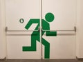 Painted green man at emergency exit Royalty Free Stock Photo