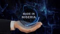 Painted hand shows concept hologram Made in Nigeria his hand