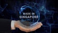 Painted hand shows concept hologram Made in Singapore his hand
