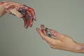 Painted hands. Reach hand. Hopeful concept. Two hands trying to touch. Adam sign. Human relation, togetherness. Hands of