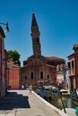 leaning tower houses and boats Royalty Free Stock Photo