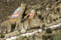 Painted images of religious figures adorn rocks at Deprung Monastery.