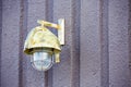 Painted iron exterior light on concrete wall Royalty Free Stock Photo