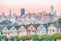 Painted Ladies Victorian houses in Alamo Square and a view of the San Francisco skyline and skyscrapers. Photo processed in pastel