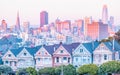 Painted Ladies Victorian houses in Alamo Square and a view of the San Francisco skyline and skyscrapers. Photo processed Royalty Free Stock Photo