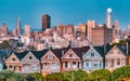 Painted Ladies Victorian houses in Alamo Square and a view of the San Francisco skyline and skyscrapers. Photo processed Royalty Free Stock Photo