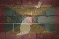 map and flag of grenada on a old brick wall Royalty Free Stock Photo