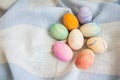 Painted multicolored Easter eggs, eggs painted with watercolors. A cute face in the middle of painted eggs. Easter card Royalty Free Stock Photo
