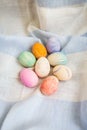 Painted multicolored Easter eggs, eggs painted with watercolors. A cute face in the middle of painted eggs. Easter card Royalty Free Stock Photo