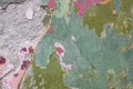 Painted multicolored weathered wall with remnants of paint of old building, abstract image, detail. Part of colorful wall. Royalty Free Stock Photo