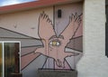 Painted mural featuring an eagle with a human eye on a wall of El Cosmico in Marfa, Texas. Royalty Free Stock Photo