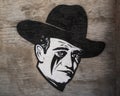 Painted mural featuring head of John Wayne by unidentified artist in Marfa, Texas.