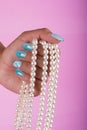 Painted nails and pearls