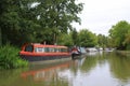 Narrowboats moored alongside English canal