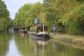 Narrowboats moored alongside English canal