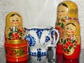 Painted nesting dolls, blue and white Gzhel tableware, bright wooden Khokhloma is a traditional Russian arts and crafts. Souvenirs Royalty Free Stock Photo