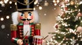 Nutcracker Holding Drum Stands Before Christmas Tree With Holiday Lights Royalty Free Stock Photo