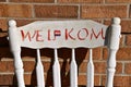 Old chair with a `WELKOM` sign Royalty Free Stock Photo