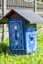 Painted old wooden beehives decorated with a hand painted colorful flowers, Zalipie, Poland Royalty Free Stock Photo