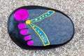 Painted pebble foot sandal. Royalty Free Stock Photo