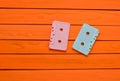 Painted in a pink blue pastel color audio cassette on an orange wooden background. Royalty Free Stock Photo