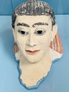 Painted plaster mask of young men at the British Museum in London