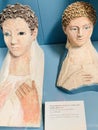 Painted plaster masks of young men at the British Museum in London