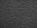 Painted plaster wall background, matte black.