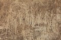 A painted plaster wall texture with scratches. An old beige wall background. Royalty Free Stock Photo