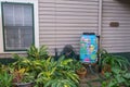 Painted Rain Barrel on Side of Uptown New Orleans Home Royalty Free Stock Photo