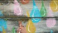 Painted raindrop design on wood Royalty Free Stock Photo