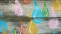 Painted raindrop design on wood