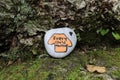 A painted rock at the base of a tree along a trail in Nova Scotia orange shirt every child matters