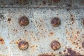 Painted rusty metal beam with four spherical rivets heads, texture, background