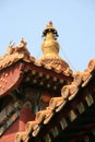 Painted and sculptured patterns decorate the facade and the roof of a buddhist temple in Beijing (China) Royalty Free Stock Photo