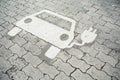 Painted sign of a hybrid car charging space on the pavement Royalty Free Stock Photo