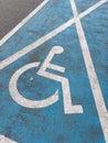 Painted sign marking reserved parking lot for handicapped and disabled people Royalty Free Stock Photo