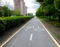 Painted signs on asphalt for bicycle dedicated lanes. A separate bike path in the city Royalty Free Stock Photo