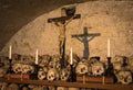 Painted skulls with names, candles and cross