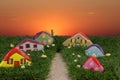 Painted stones in the shape of homes  as leisure activity for children Royalty Free Stock Photo