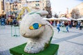 Painted three-dimensional figure of a rabbit or hare with hypnotic yellow eyes with blue iris in grey color. Beautiful art easter