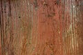 Painted vibrant brown old faded wooden planking background with flaws