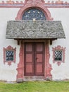 Painted wall with wooden doors Catholic chapel Royalty Free Stock Photo