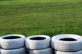 Painted white old tires on kart race course Royalty Free Stock Photo